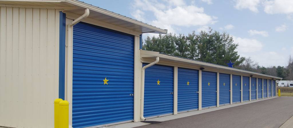 Row of storage sheds with wide drive aisles
